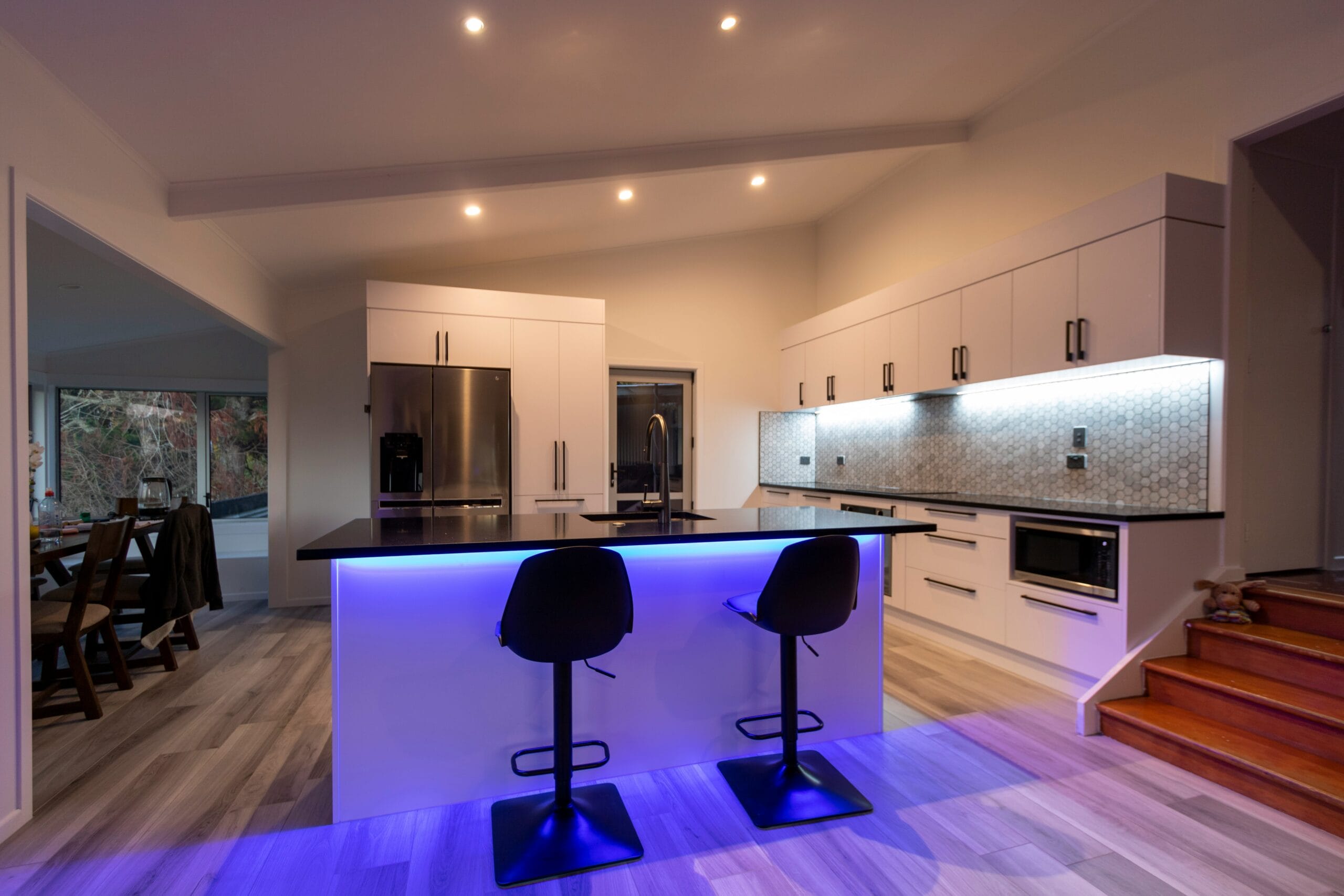 black and purple chairs on brown wooden floor